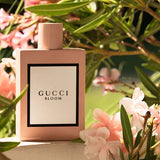 gucci bloom edp for her frangrance bottle amongst floral notes